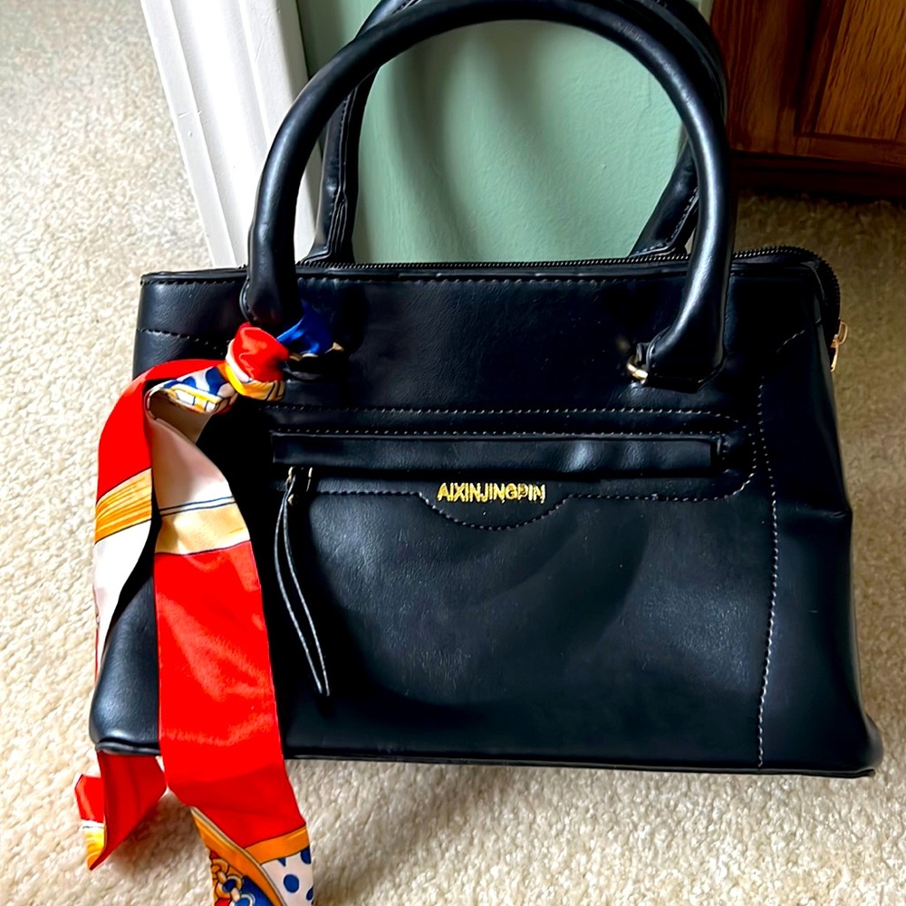 New black purse, this is a medium/small bag with lots of pockets and room